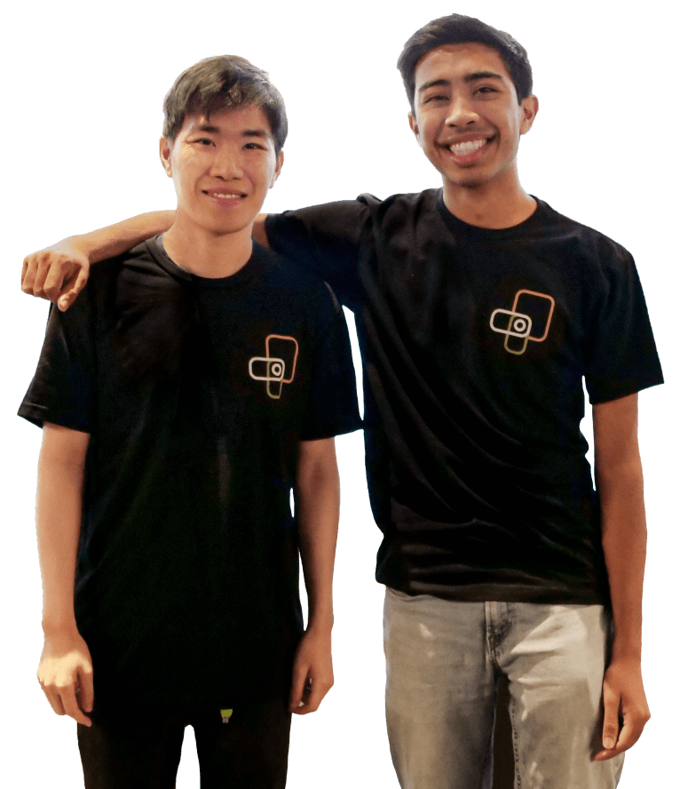 Two interns in black shirts with a Proctorio logo at the upper right. They are smiling broadly, one's arm slung around the other's shoulders.